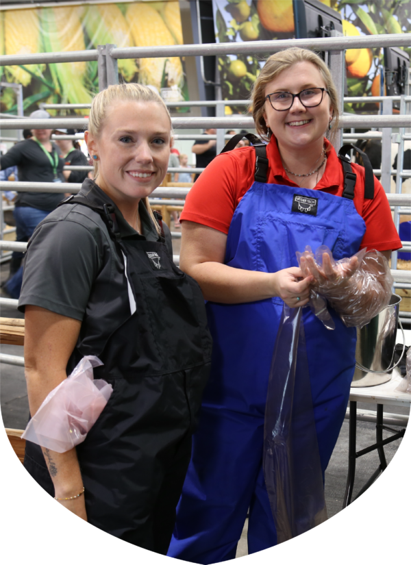 two women wearing overalls