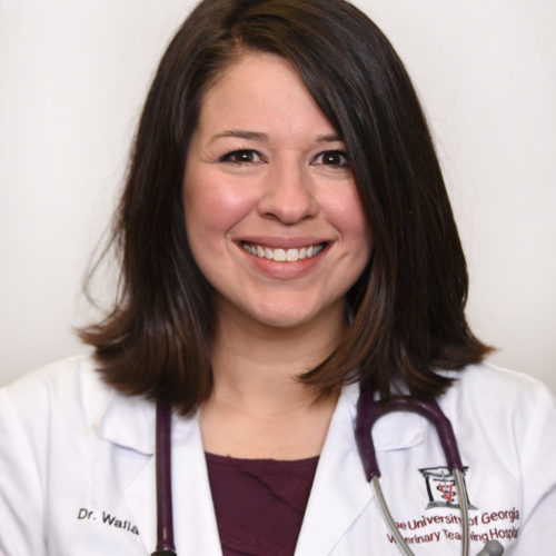 a woman wearing a white lab coat